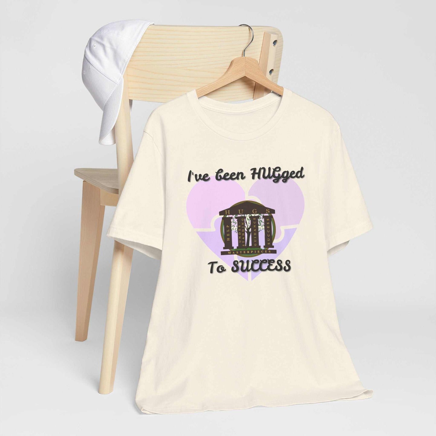 Lightweight pale blush Hugged To Success Tee with vintage storefront and pastel heart graphic