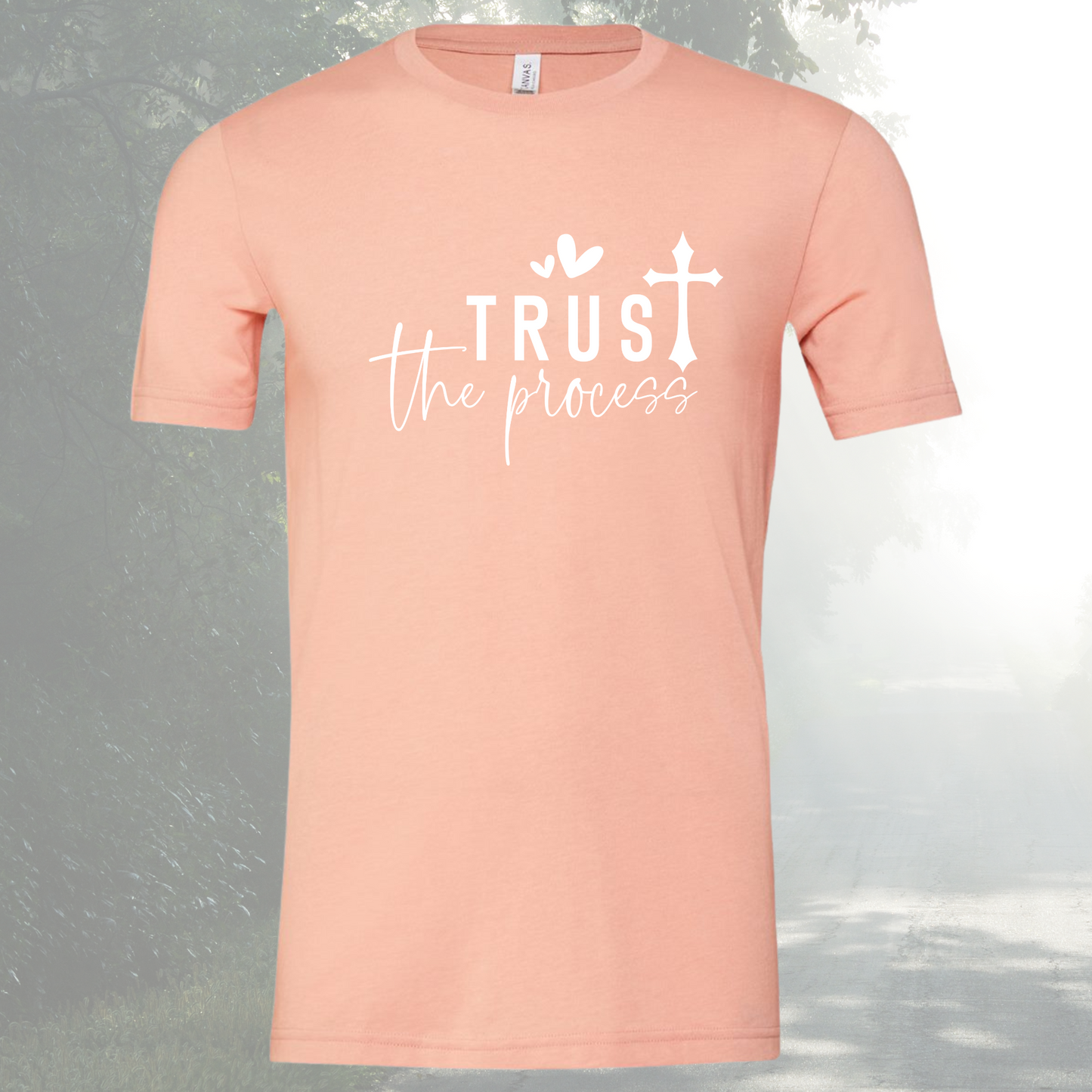 Unisex peach Trust The Process tee with crew neck design.