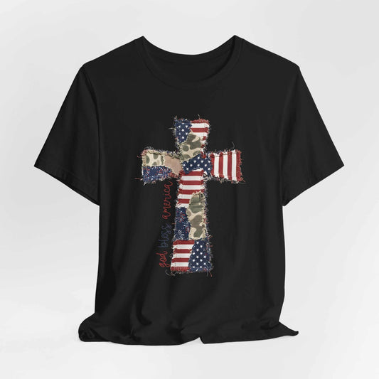 God Bless America shirt with patriotic cross, distressed flag, camouflage accents, and vintage patchwork design