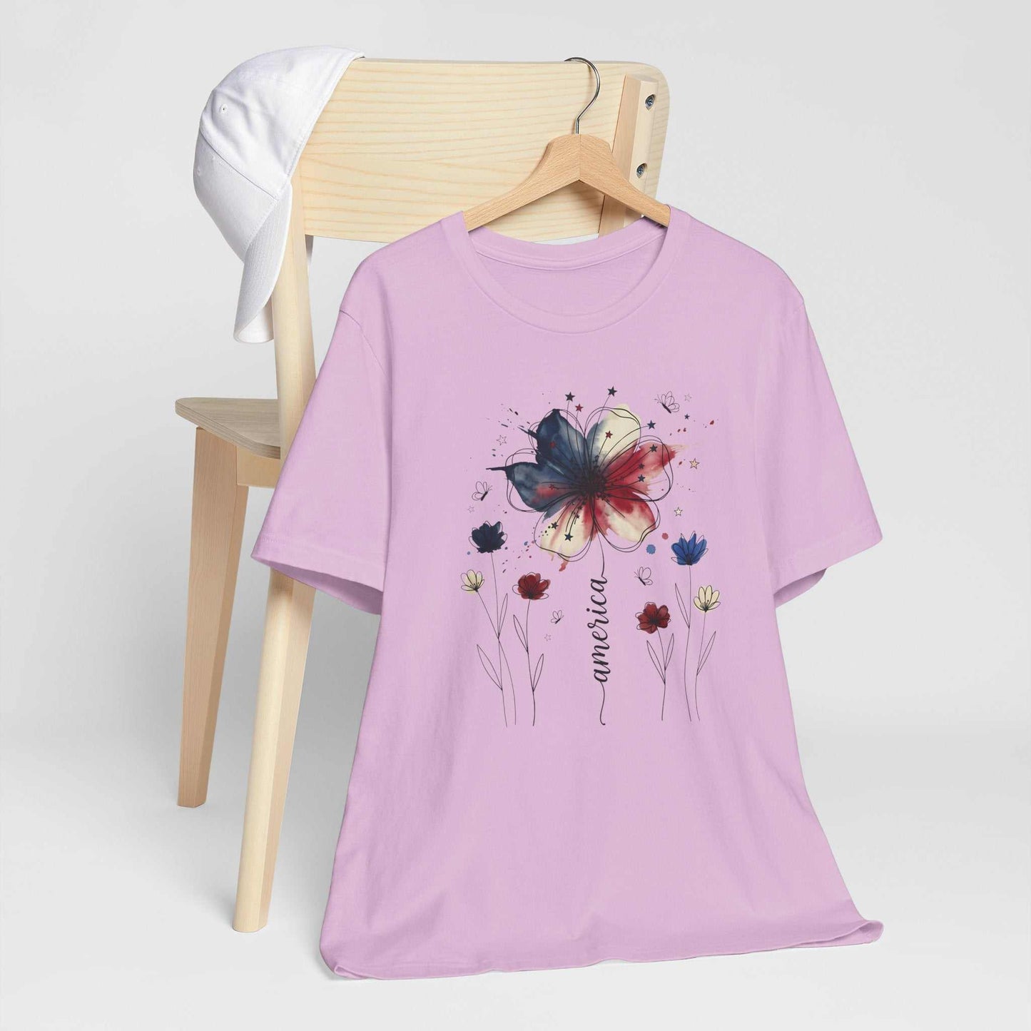 God Bless America Patriotic Floral Tee with red, white, and blue watercolor florals on Bella Canvas 3001 unisex shirt