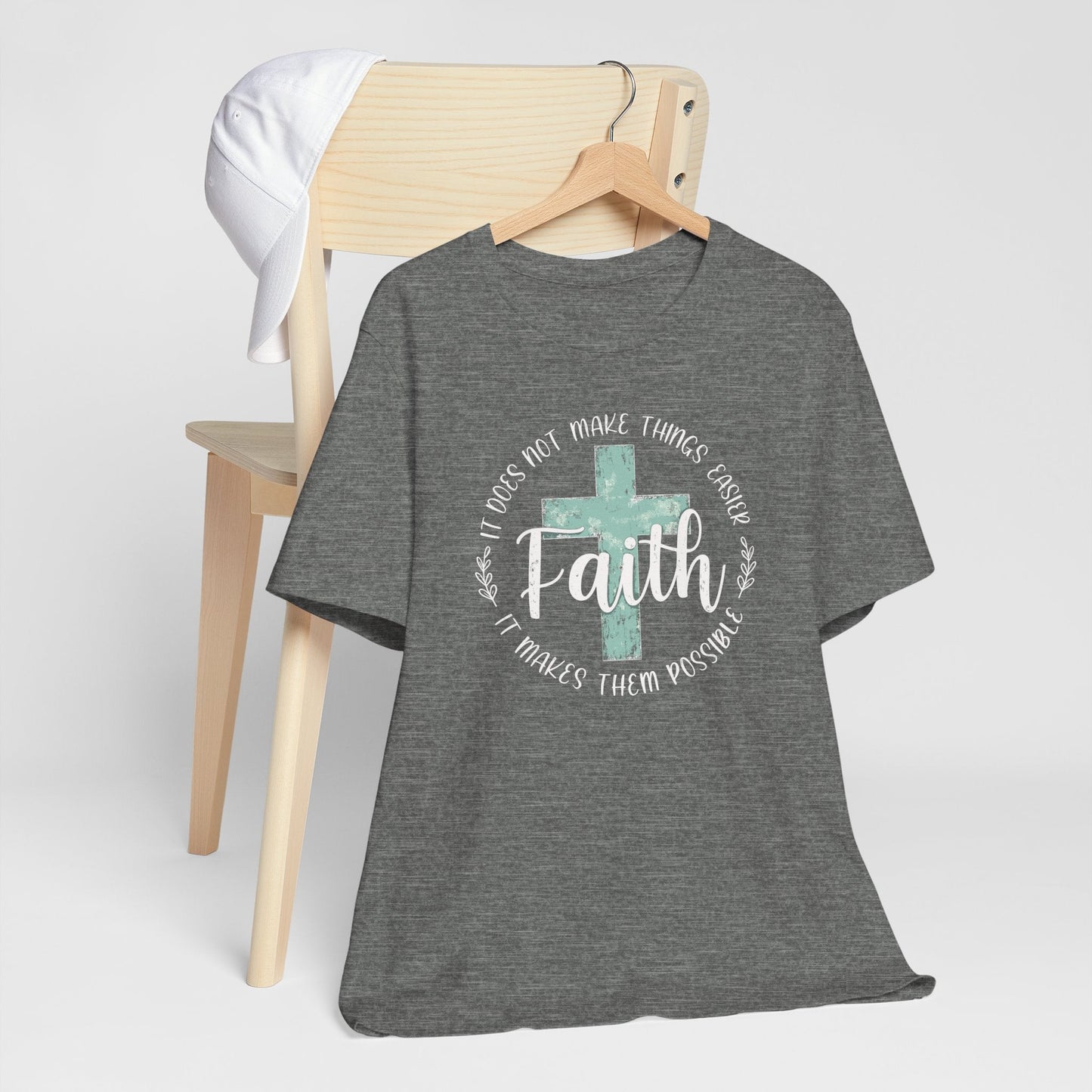 Christian woman wearing Faith Over Fear T-Shirt with distressed cross design, inspirational message on front