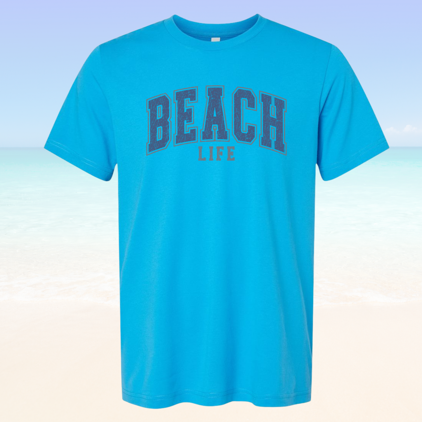 Blue unisex Beach Life Vibe tee shirt with "BEACH LIFE" text on front, perfect for beach wear