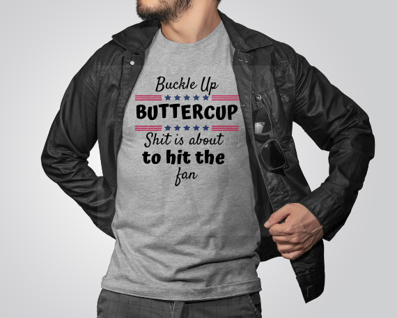 Person wearing a gray t-shirt with a humorous graphic  sayingBuckle Up Buttercup Shit is About to Hit the Fan Tee