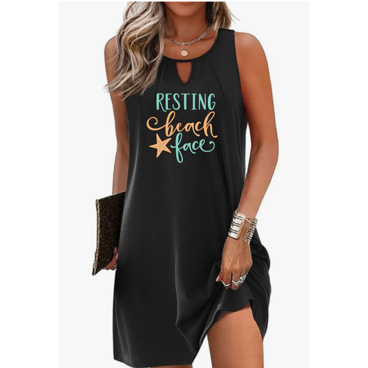 Woman wearing Resting Beach Face cover-up dress with coastal design and keyhole neckline at the beach