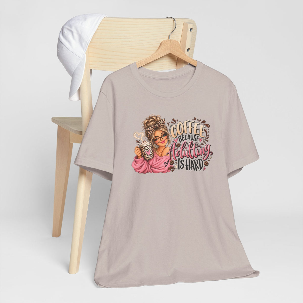 adulting tshirt in dusty mauve with a colorful coffee-loving woman graphic and “Coffee Because Adulting Is Hard” lettering
