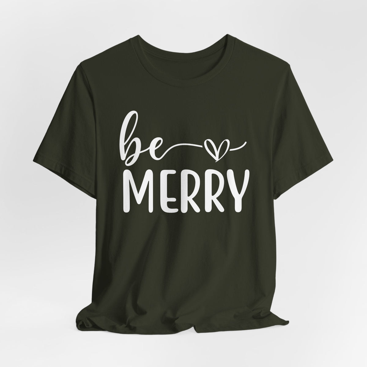 Be Merry Christmas Graphic Tee in dark olive cotton with white script and block lettering and a heart accent