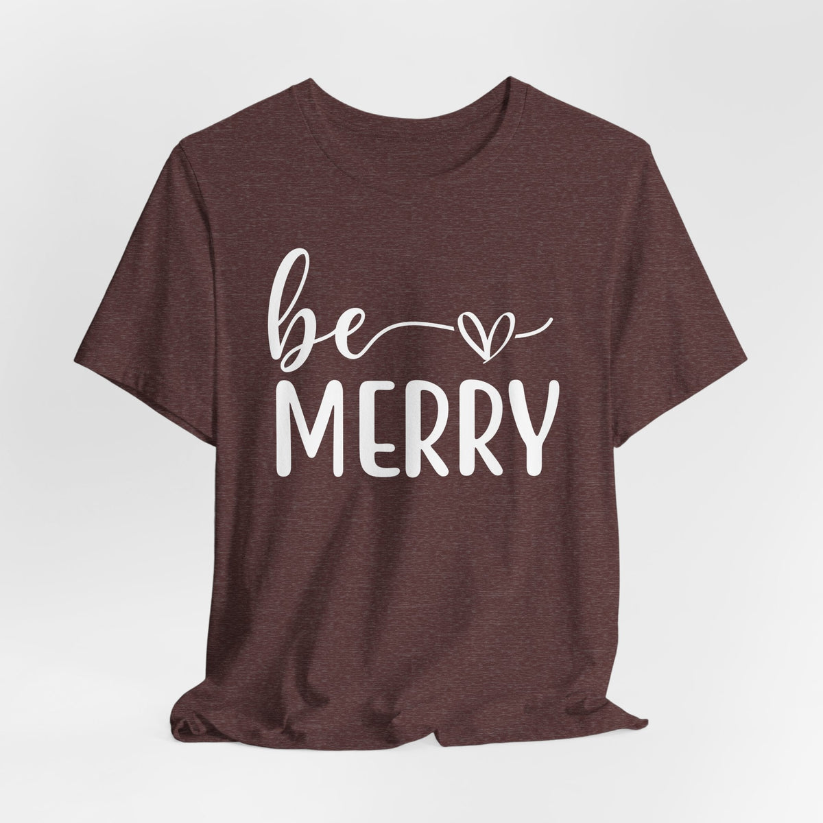 Be Merry Christmas Graphic Tee in heathered burgundy with white script and block lettering and a heart detail