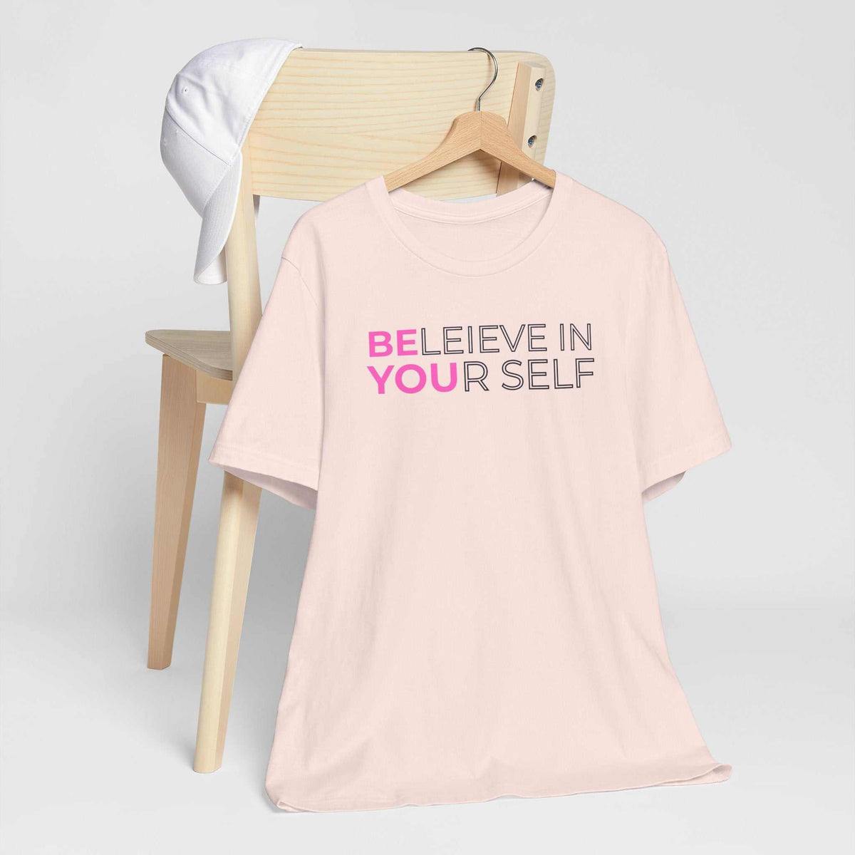 believe in yourself tshirt in pale pink with bold pink and black motivational lettering reading “Believe in Yourself”