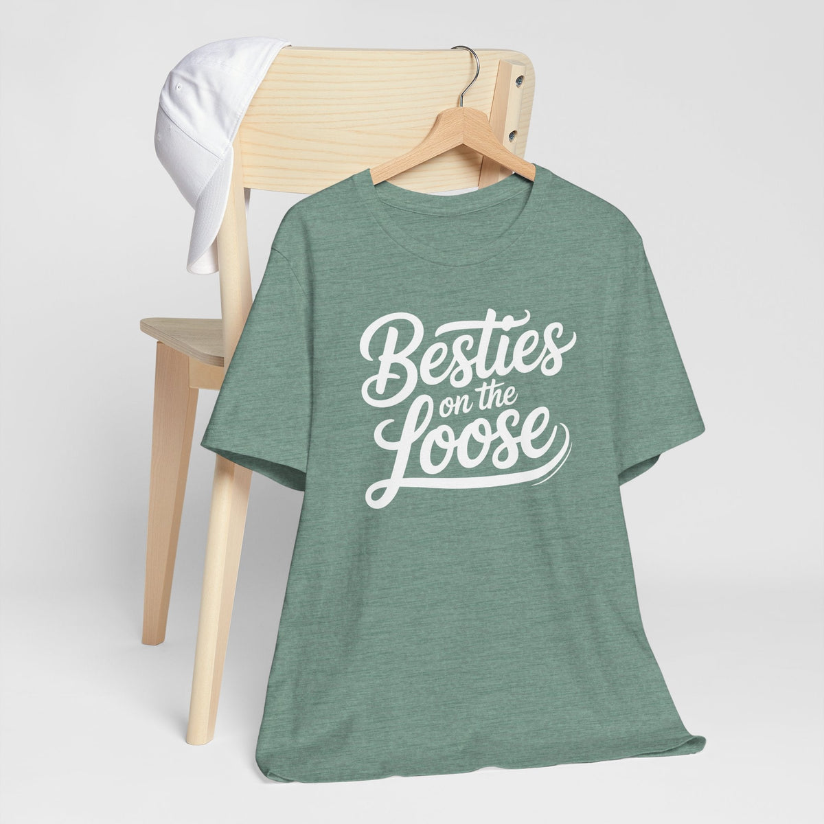 best friend funny tshirt in heather sage green cotton blend with short sleeves and white “Besties on the Loose” lettering