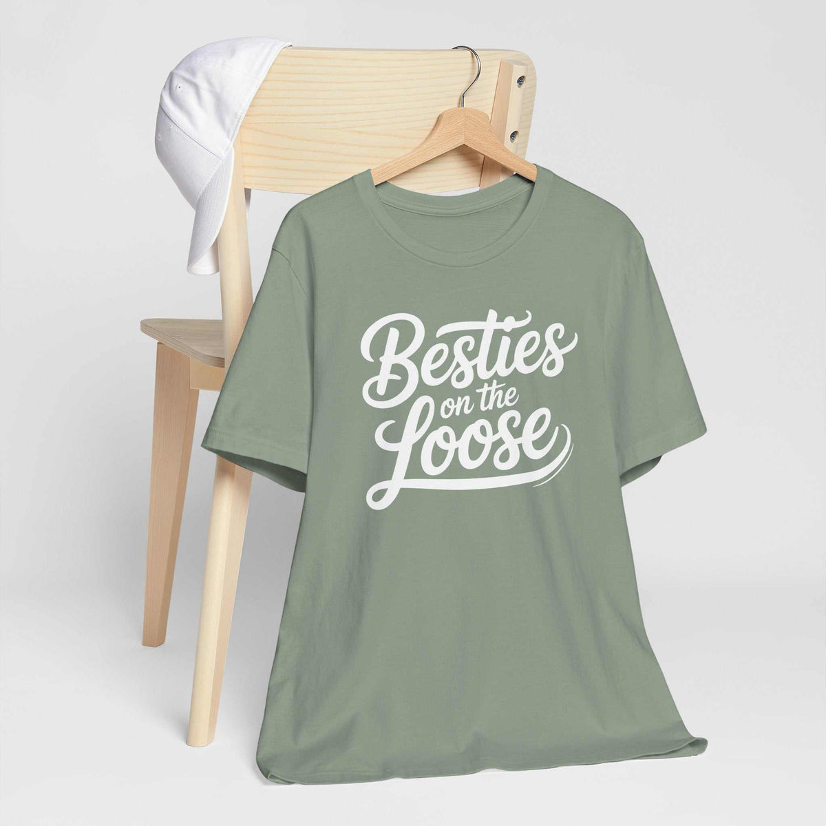 best friend funny tshirt in sage green cotton with short sleeves and white “Besties on the Loose” lettering