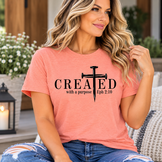 christian printed shirts in coral heathered fabric, featuring black CREATED lettering and a cross design with Ephesians 2:10