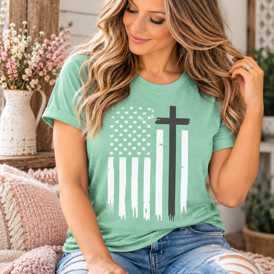 Christian shirt for women in mint green cotton with a distressed white American flag and bold dark cross graphic