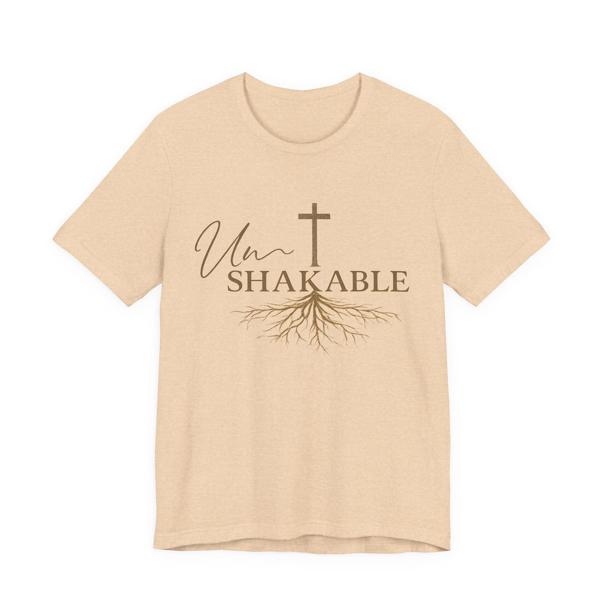 christian tshirts for women: beige cotton tee with brown Unshakable lettering, cross, and flowing roots graphic