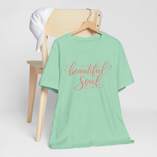 Women’s cute graphic tees mint green cotton-look T-shirt with coral pink “Beautiful Soul” script and sparkle accents.
