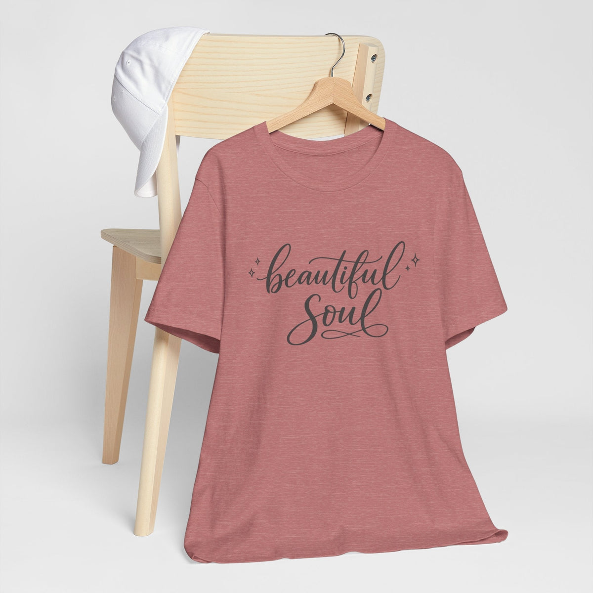 Graphic T-shirt in dusty rose heather fabric with “beautiful Soul” script and small decorative accents, among cute graphic tees.