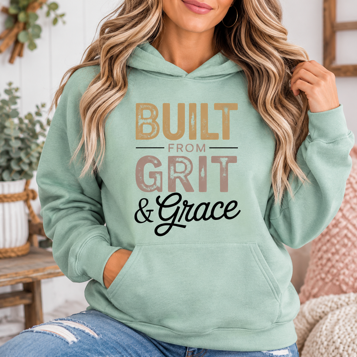cute sweatshirts for women, a sage green fleece hoodie with a kangaroo pocket and distressed Built From Grit & Grace graphic