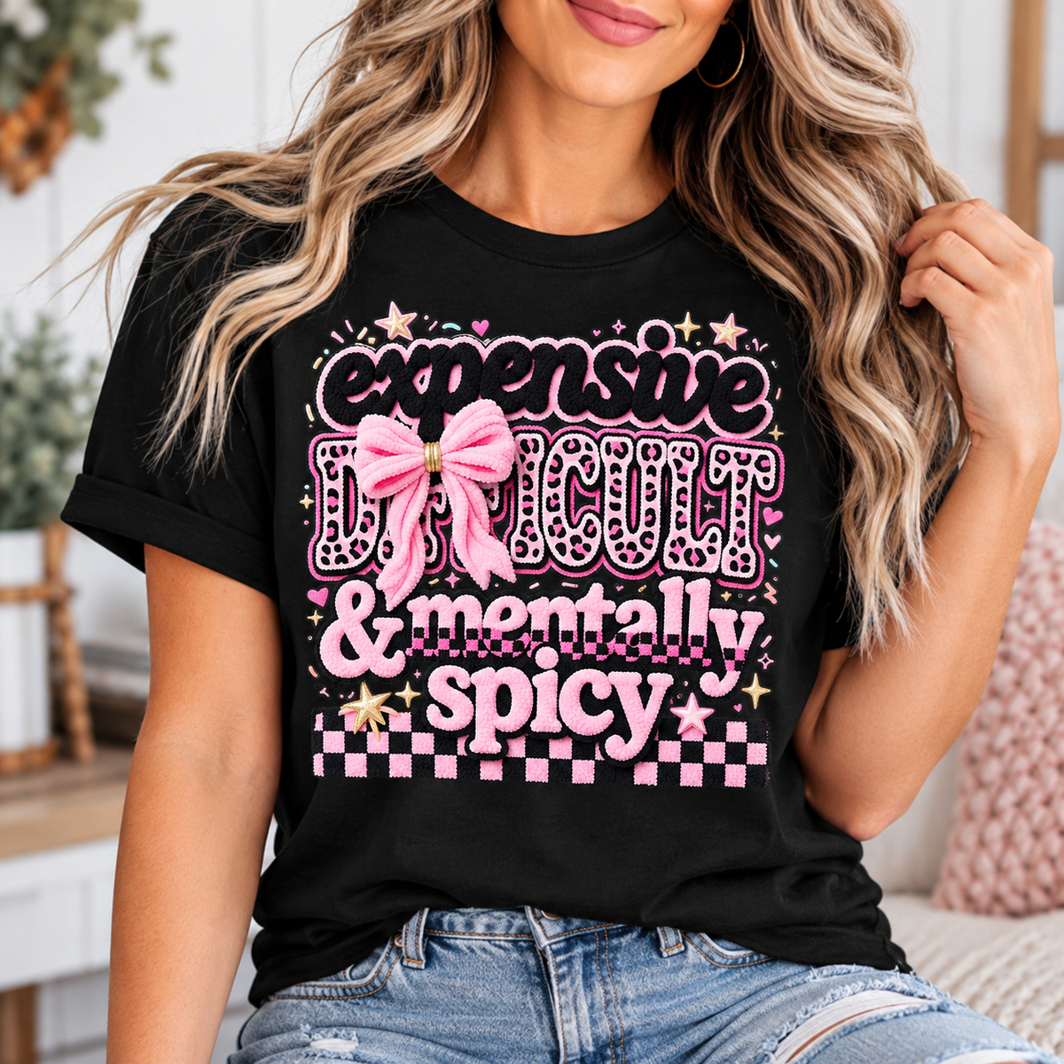 fun womens graphic tee in black with pink bow, leopard-print lettering, stars and checkerboard details