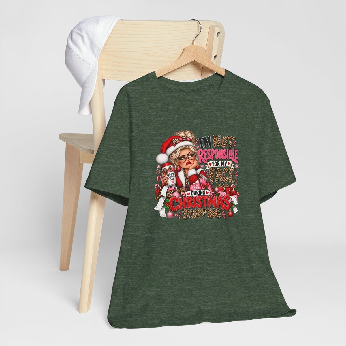 funny christmas shirt in dark green fabric with a colorful Santa shopper graphic and bold festive lettering