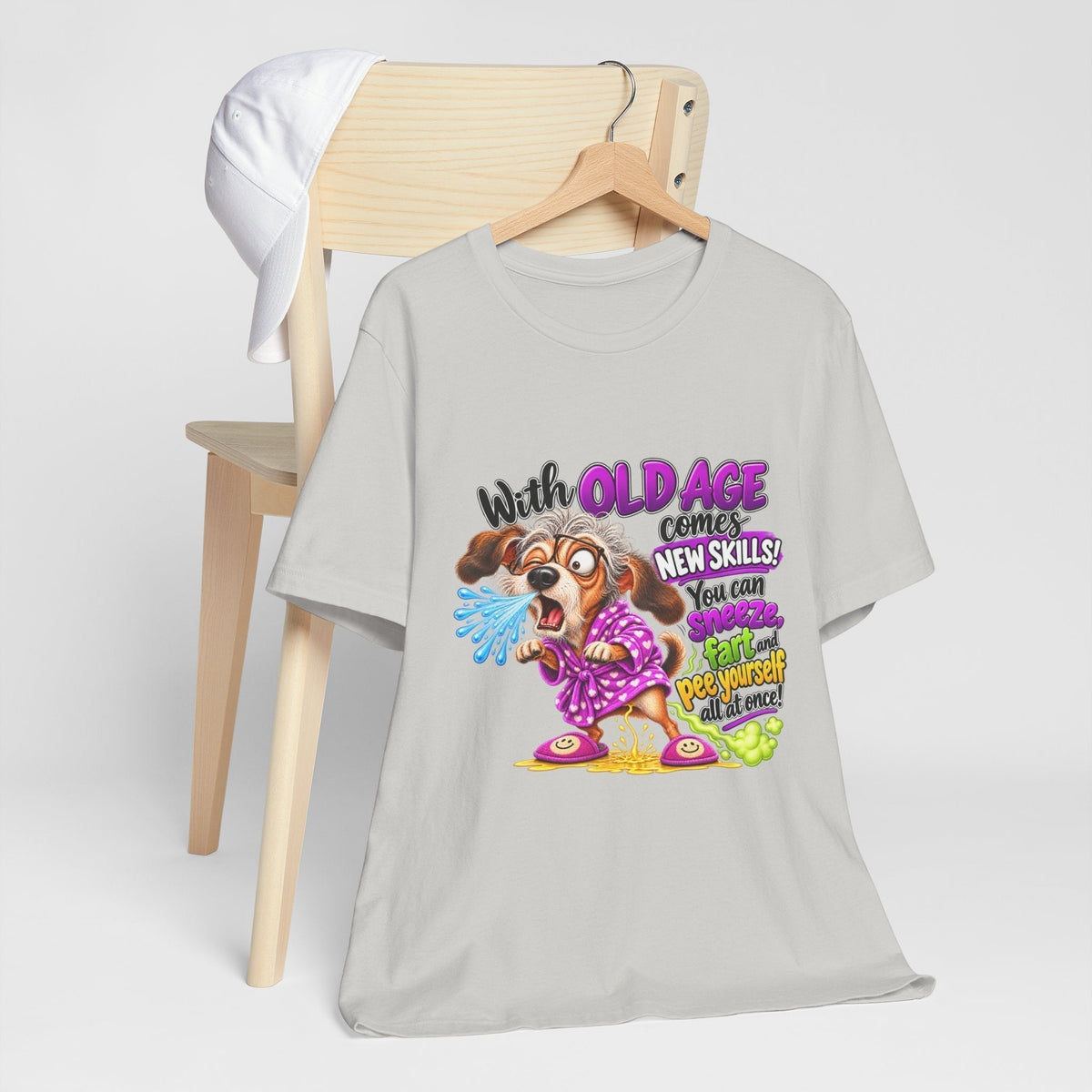 funny old age tshirt, light gray cotton tee with a colorful cartoon dog and playful aging skills slogan graphic