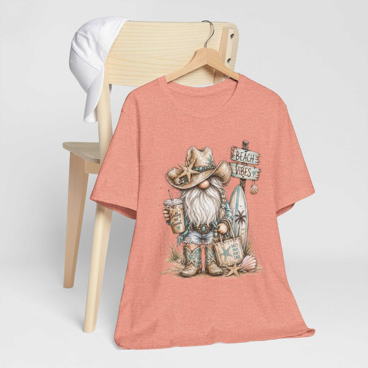 Gnome t shirts in coral heather with a short sleeve crewneck and watercolor beach gnome in a cowboy hat