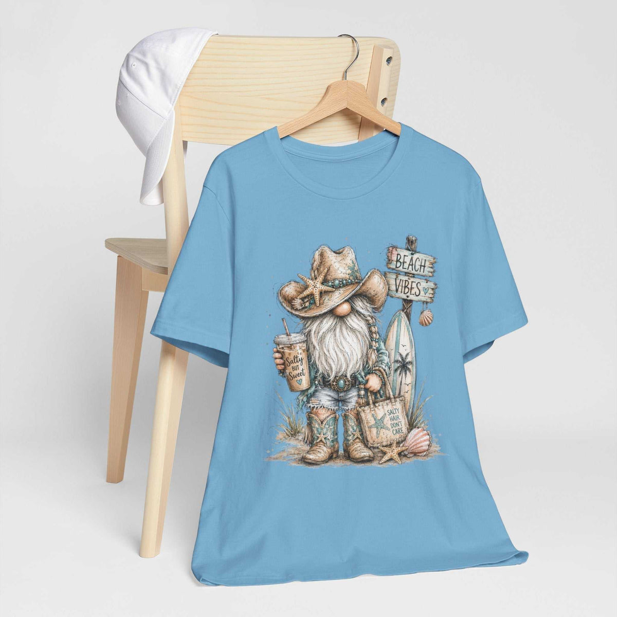 gnome t shirts include a light blue crewneck tee printed with a bearded beach gnome, starfish hat and beach sign