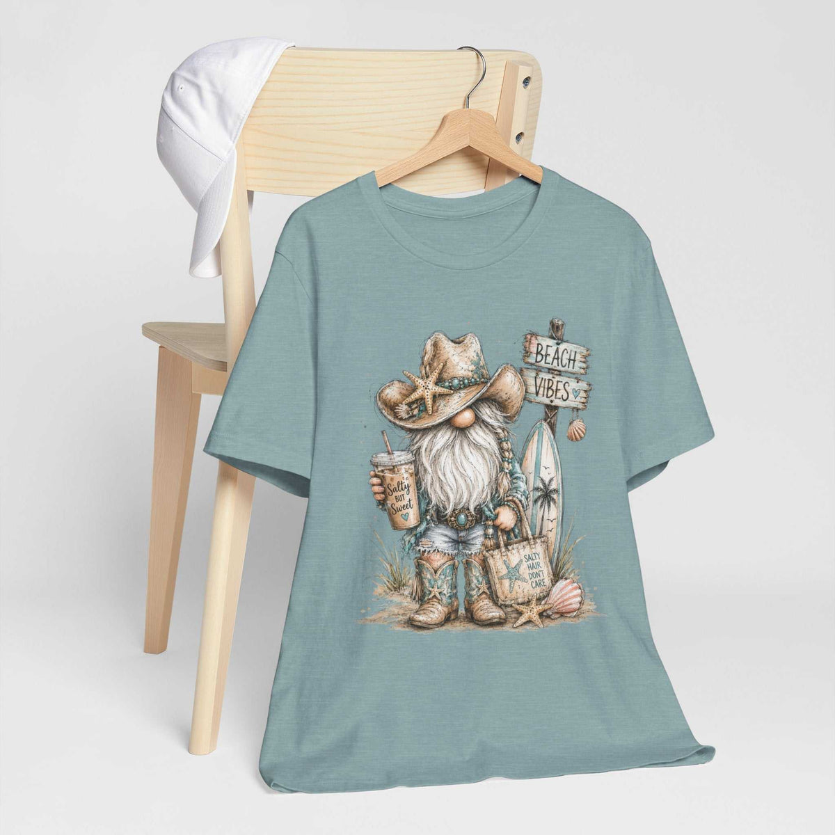 gnome t shirts features a muted blue cotton tee with a watercolor beach gnome in a starfish cowboy hat and boots