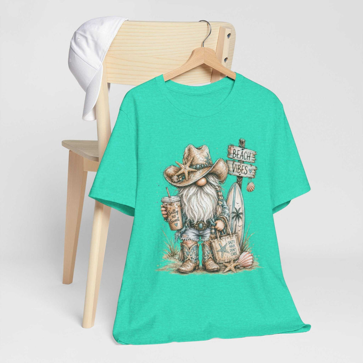 gnome t shirts turquoise crewneck tee with a coastal gnome wearing a starfish cowboy hat beside beach signs and shells