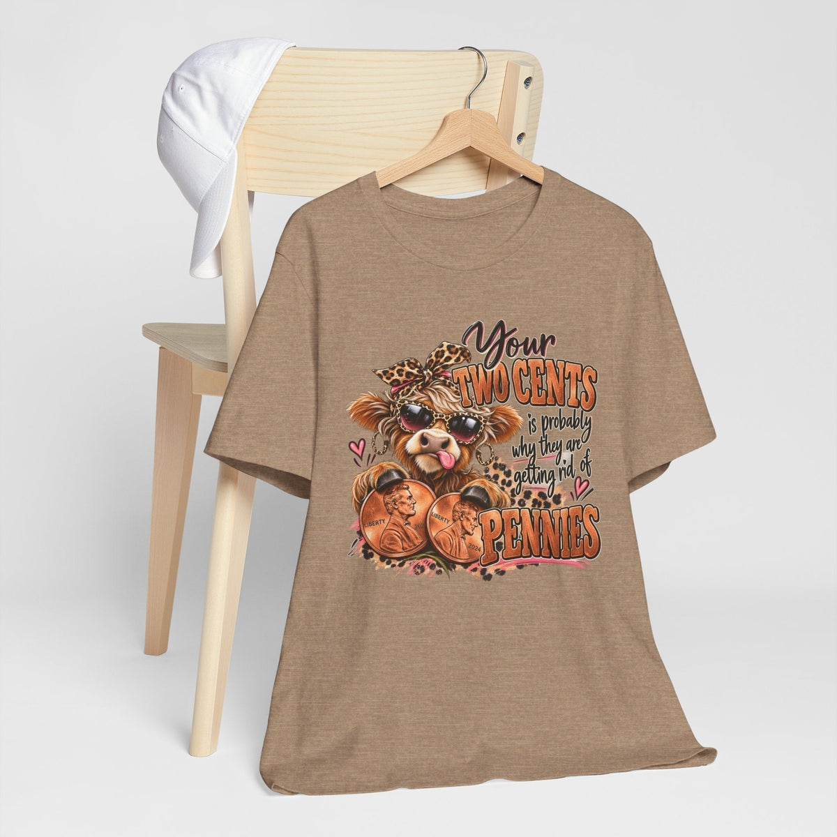 Highland cow funny graphic tee in brown with a colorful shaggy cow and cheeky two cents and pennies slogan