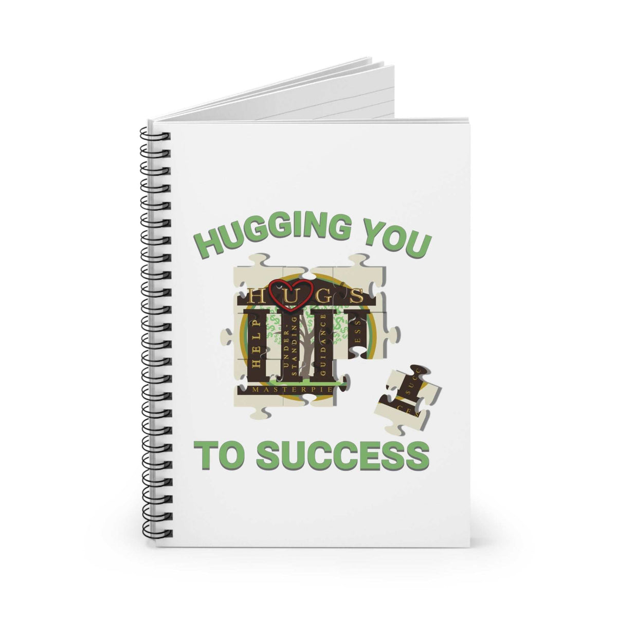 I've Been HUGGed to Success notebook with a white cover, green lettering, puzzle-piece graphic and black spiral binding