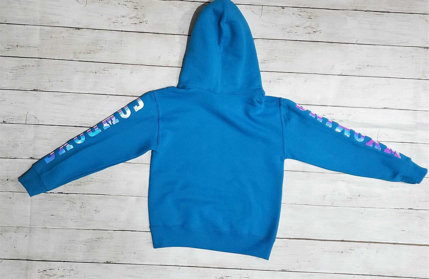 Wyoming Cowboy Youth Hoodie in California Blue with holographic logo on sleeves, iconic design for University of Wyoming pride.