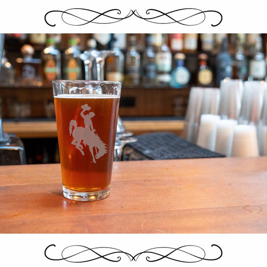 University of Wyoming pub glass with etched logo, 16 oz, dishwasher and freezer safe.