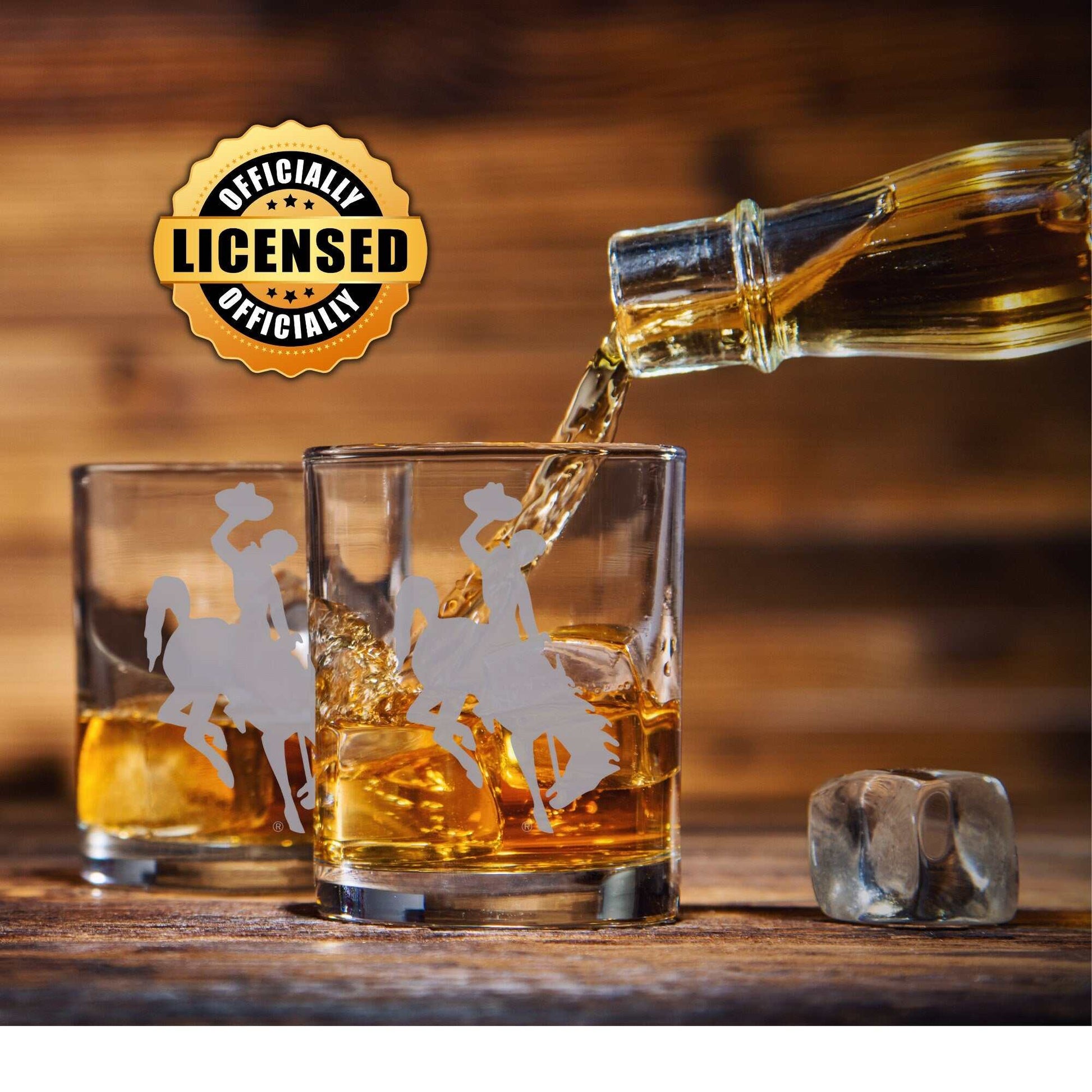 Wyoming Whiskey Glass with University of Wyoming Cowboys logo, showcasing distinctive hand-etched design, perfect for home bars and whiskey enthusiasts.