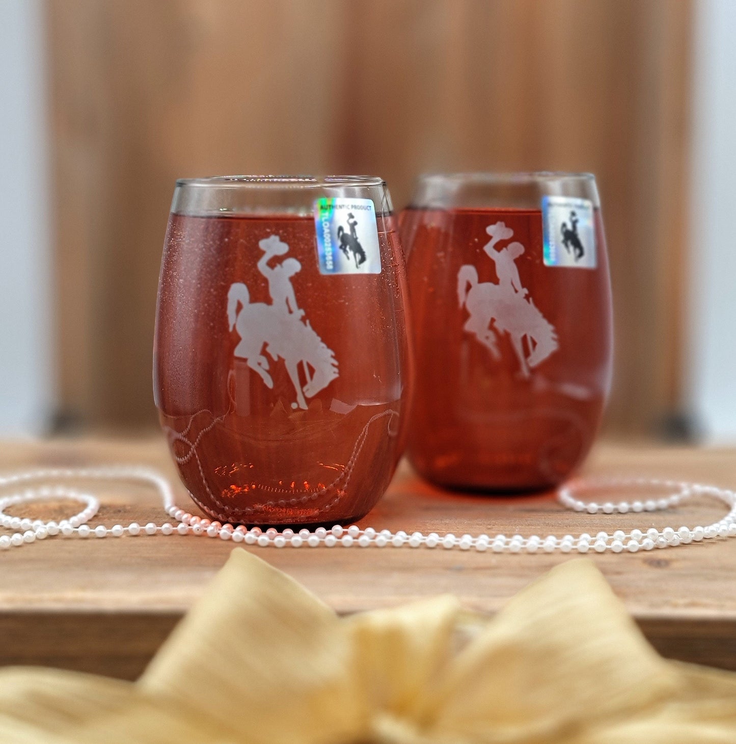 Wyoming Wine Glass Set with smokey grey finish and etched Bucking Bronco logo.