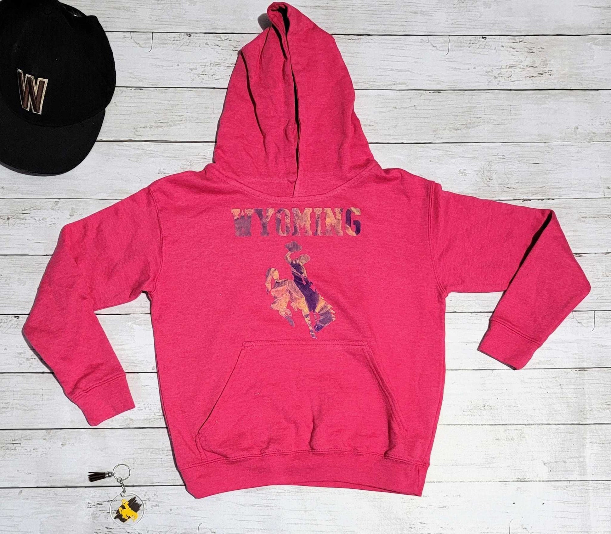 Wyoming Cowboys Youth Apparel berry colored hoodie with bucking horse design.