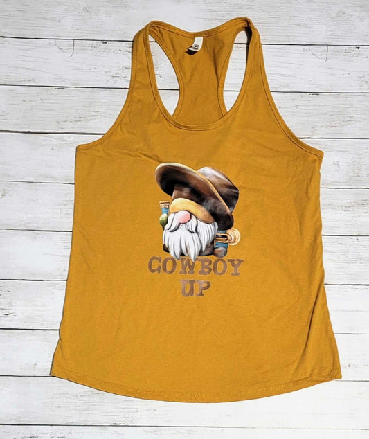 Gold-colored women's tank top with a gnome design and "Cowboy Up" text.