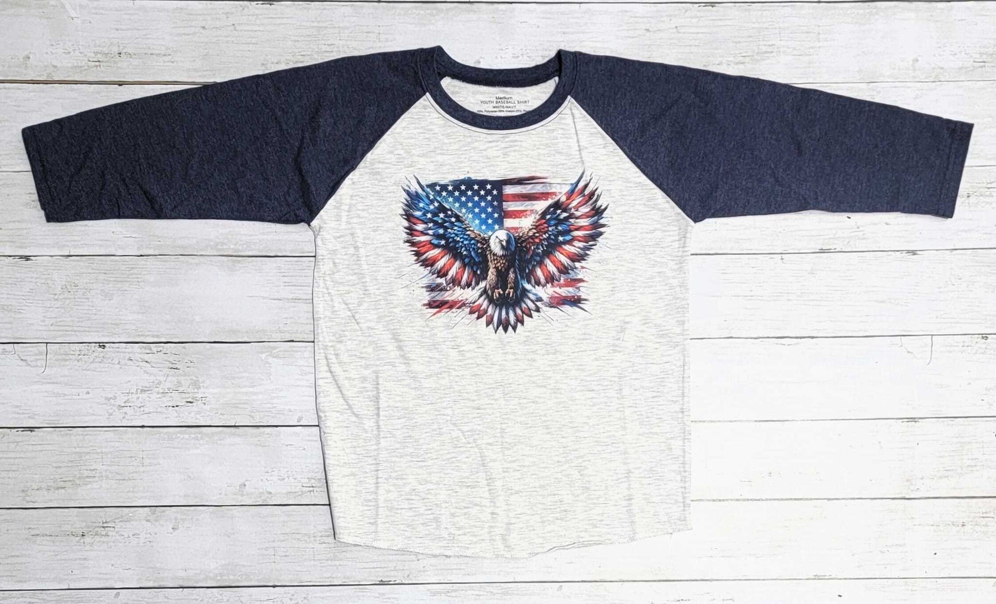 American Flag Youth Shirt with navy sleeves and eagle design on white fabric.