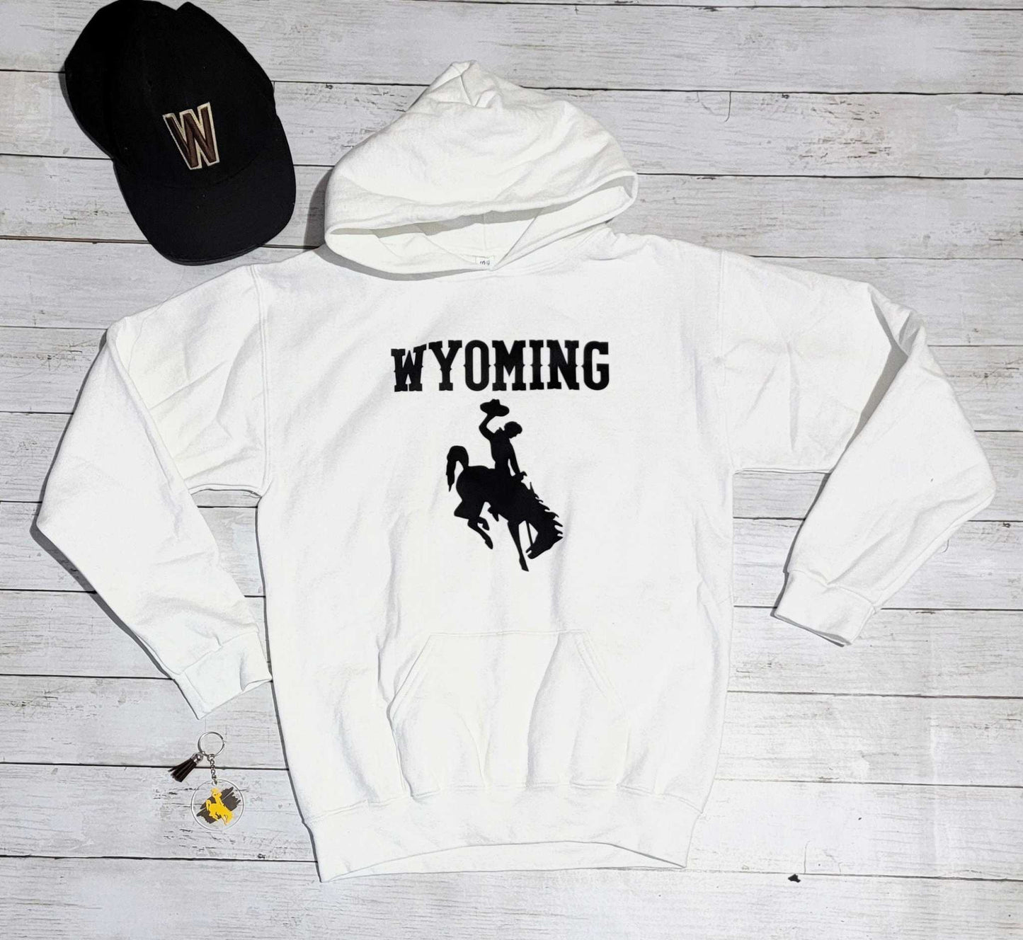 Wyoming Cowboys Youth Apparel white hoodie with bucking horse and Wyoming text.