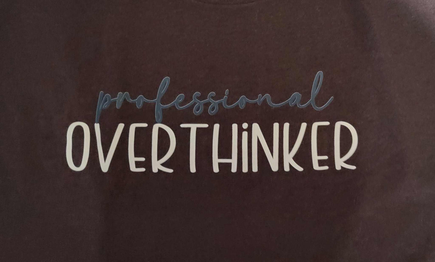 Professional Overthinker shirt with intricate lettering design.