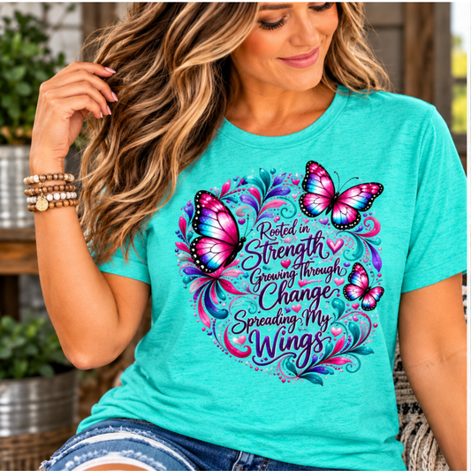 Women's turquoise inspirational tshirt design featuring vivid pink butterflies and colorful scrollwork around a growth message