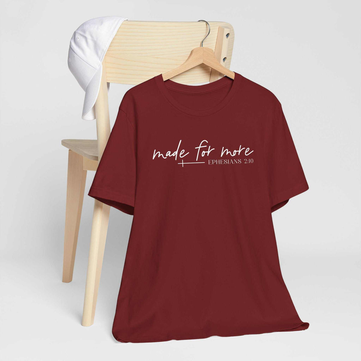 love in faith shirt in burgundy cotton with white “made for more” script and Ephesians 2:10 lettering