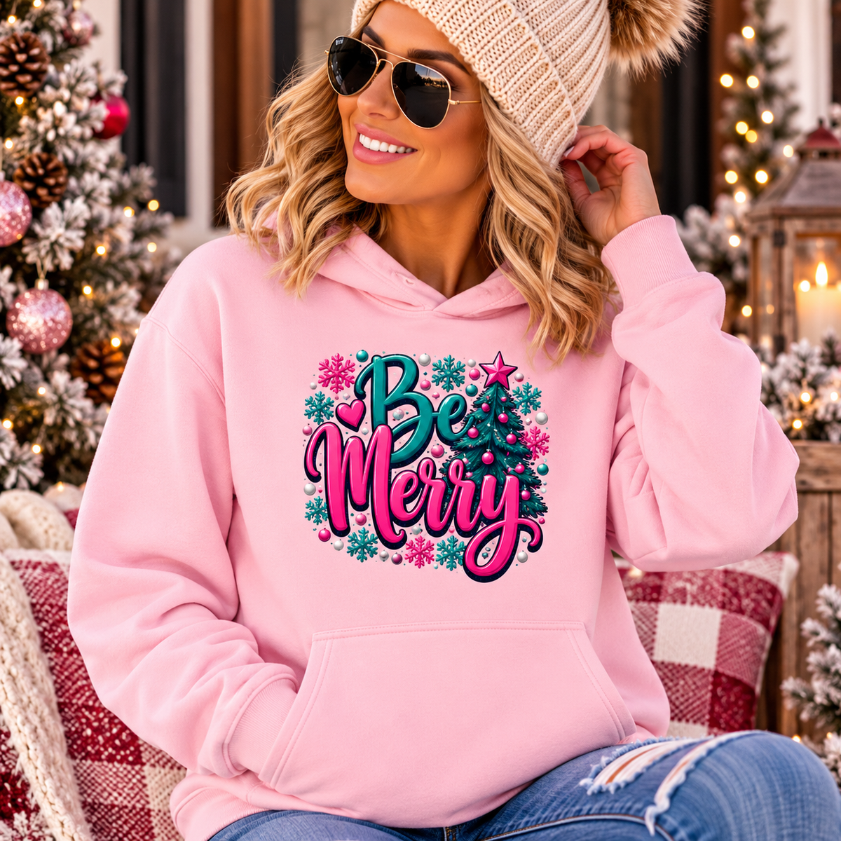 Merry Christmas Floral Holiday Hoodie in pink with a colorful Be Merry design framed by festive floral motifs and snowflakes