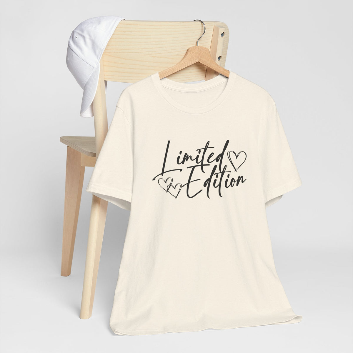 motivational graphic tee in cream cotton with black “Limited Edition” script and delicate heart details