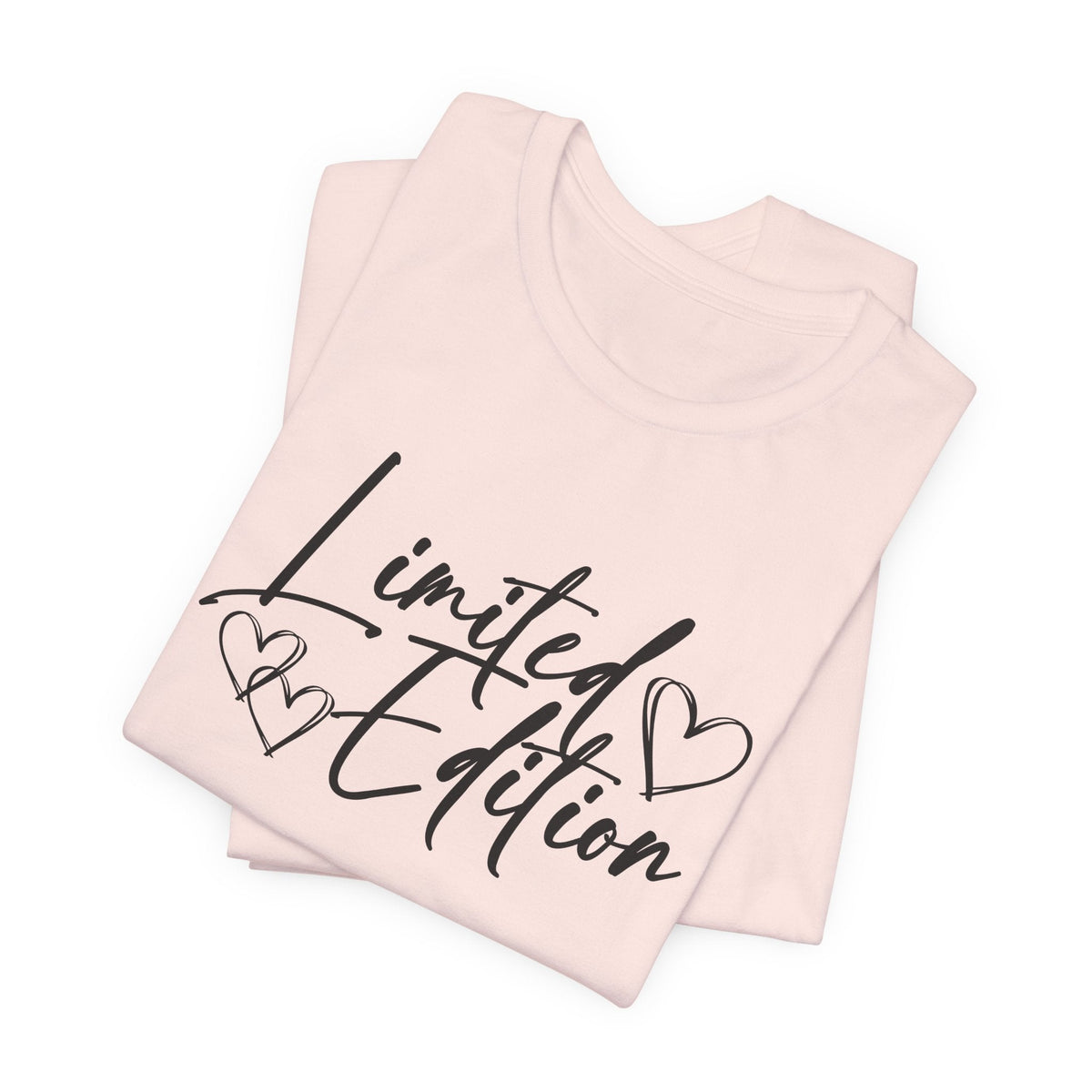 motivational graphic tee in pale pink with dark cursive “Limited Edition” lettering and heart outlines