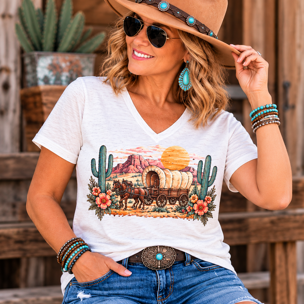 Women's white V-neck tee with a colorful Western horse-drawn wagon, desert cacti and flowers; Please Be Patient I'm From the 1900s