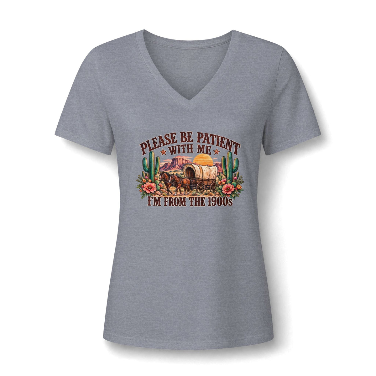 Women's V-neck T-shirt in heather gray cotton blend, featuring Please Be Patient I'm From the 1900s text with a colorful wagon, cacti, and flowers.