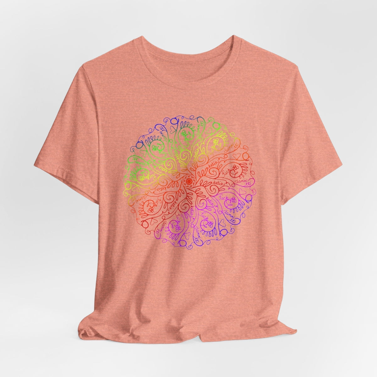 swear word tshirt in dusty peach cotton with a bright rainbow mandala featuring intricate swirling floral linework