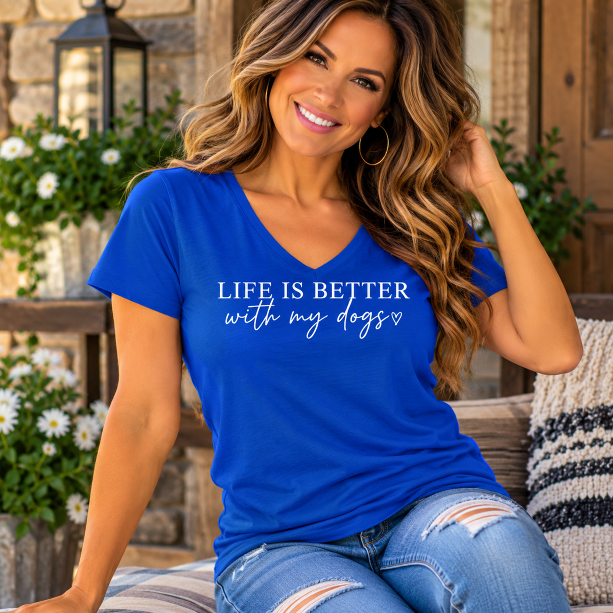Women's blue v-neck tee in soft cotton, printed with white “Life is better with my dogs” lettering and heart for tshirts for dog lovers