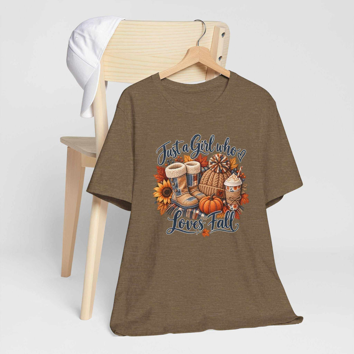 womens fall shirts brown short-sleeve T-shirt with a colorful patchwork fall graphic featuring boots, pumpkins, sunflowers and leaves