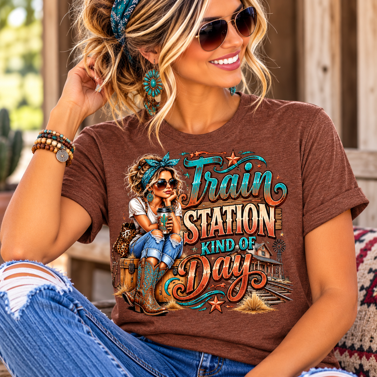 womens western graphic tee in heather brown with colorful turquoise and rust train station lettering and cowgirl artwork