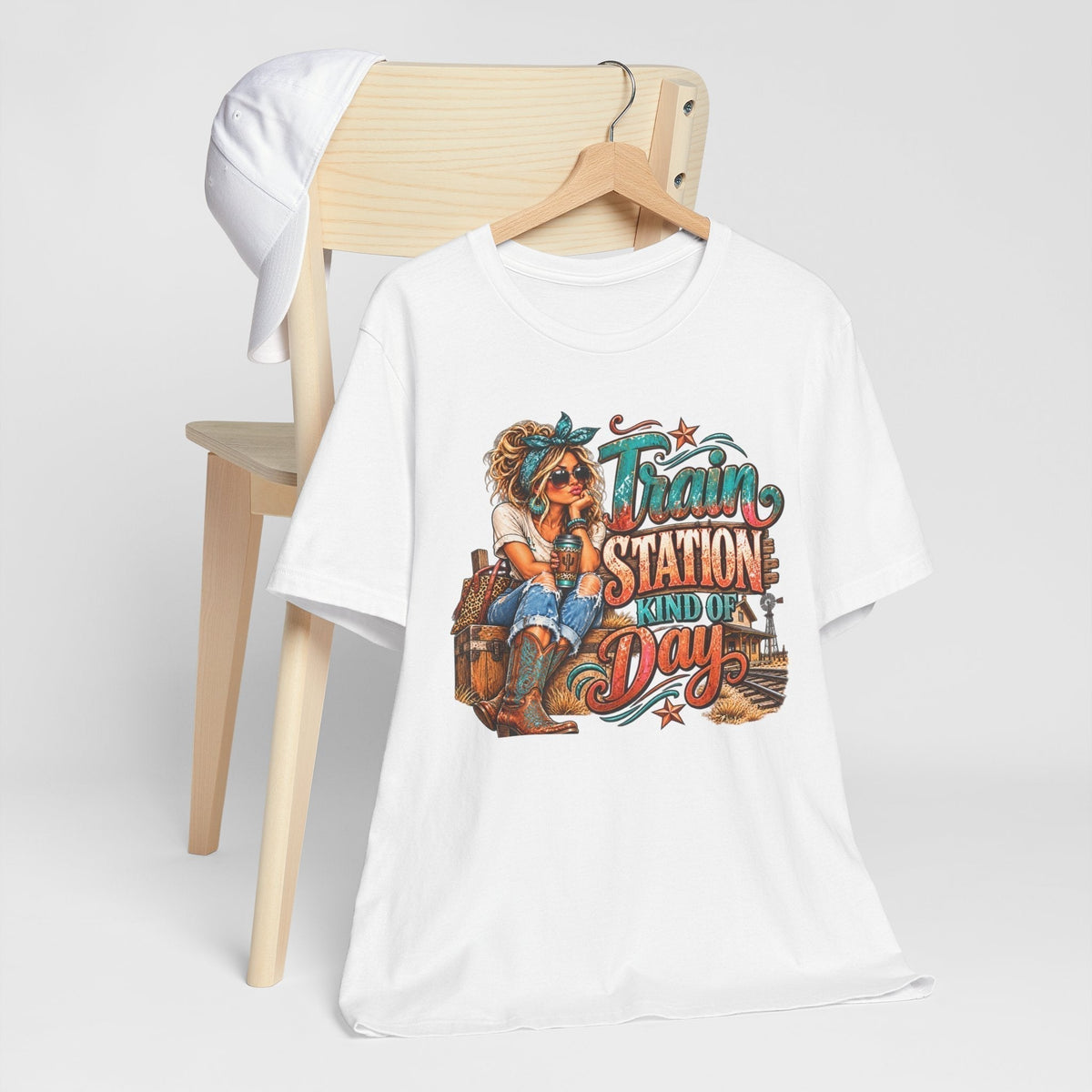 womens western graphic tee in white cotton with colorful turquoise and rust railway lettering and cowgirl illustration